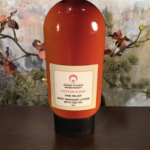 bottle of cbd massage oil by H2E Aromatherapy